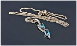 9ct White Gold Pendant Set With Blue Topaz And Diamond, Suspended On A 9ct White Gold 17 Inch