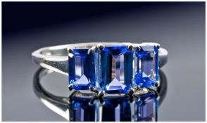 Tanzanite Octagon Trilogy Ring, 1ct octagon cut central stone flanked by two similar .5ct stones,