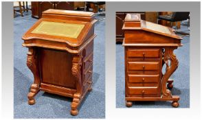 Edwardian Mahogany Davenport with stationary department. Above a leather inset slope, enclosing a