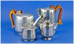 Picquot Ware 4 Piece Alloy Tea Set in the high arty deco shape of unusual form, the handles shaped