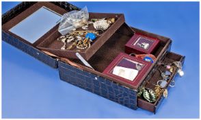 Jewellery Box containing a selection of  rings, watches, necklaces and earrings.