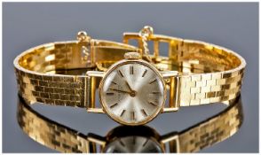 Longines Fine Ladies 18ct Gold Manual Wind Wrist Watch. Complete with 18ct gold strap. Circa 1980`