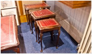 A Modern Nest of 3 Tables plus a matching coffee table. Red leatherette tops. 22 inches high.