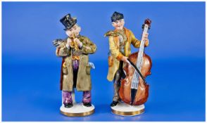 German Porcelain Hand Painted Mid 20th Century Pair Of Musical Figures, One playing the trumpet and