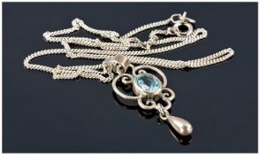 Silver Openwork Pendant Set With A Blue Topaz Coloured Stone, Suspended On A 16 Inch Silver Chain,
