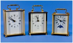Modern Carriage Clocks, 3 in total. Quartz driven with brushed gold finish. All standing on ball