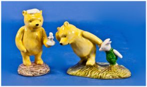 Royal Doulton Winnie The Pooh Collection. 1, Pooh and Piglet on a windy day. 2, Pooh lights on a