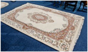 Large Rectangular Wool Rug, Floral decoration on beige ground. As new condition. 111 by 73 inches.