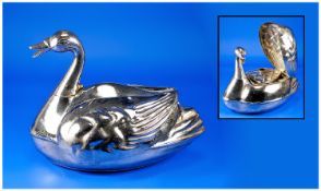 Chromed Duck Shaped Warming Vessel, the head and neck of the duck twists to either side to allow