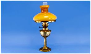 Edwardian Table Brass Oil Lamp with twin wicks and gold glass shade. 21`` in height. Good