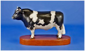 Beswick Animal Figure `Friesan Bull` on teak plinth. Model number 1439. Issued 1968-73. 5.5`` in