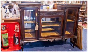 Edwardian Mahogany Glazed Front Display Cabinet, with a central shaped glazed door. Flanked by two