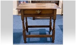 A Mid 18th Century Oak Low Side Table, with single draw, above turned supports. 28.25 inches high,