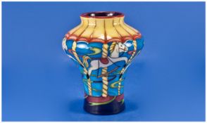 Moorcroft Modern Vase ``Carousel`` Design. Fair ground. Designer Keri, date 2002. 5.5 inches high.