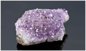 A Quality Piece of Rock Quartz Amethyst. Weight 148.3 grams. 3 inches wide.