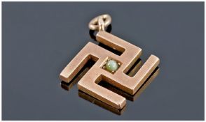 German Gold Pendant in the Form of a Swastika, marked 1913. 3/4 inches high. 2.2 grams.