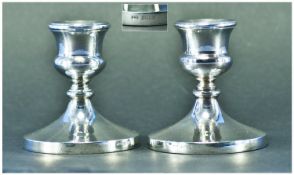 A Pair of Silver Squat Candlesticks. Hallmarked Birmingham 1954. Each 3.25 inches high.