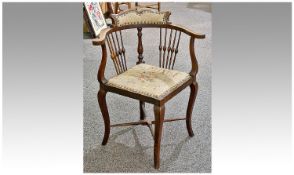 Edwardian Walnut Corner Chair, embroidered seat, splayed legs with stretchers. Spindled back. c