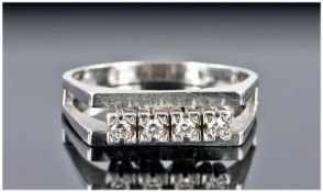 A Modern 18ct White Gold Set Channel Set Diamond Ring. Marked 18ct. 5 grams.