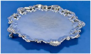 Edwardian Silver Plated Salver with scroll and shell border. Raised on 3 shell, vacant cartouche.