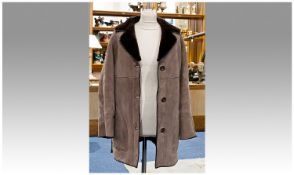 Taupe Sheepskin Suede Long Jacket with dark brown fur reverse forming the collar and inner, the