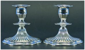 A Good Quality Pair of Regency Style Silver Plated Candlesticks. Each 5 inches high.