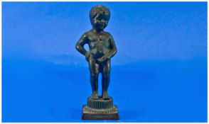 Small Bronze Figure Of A Nude Boy, on a square base. Marked to base `Bruxells`. Height 5 inches.