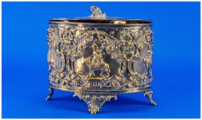 A Victorian Silver Plated Oval Biscuit Barrel with an embossed decorative body in the Gothic style