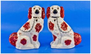 Two Staffordshire Spaniel Figures, with yellow baskets. 10 inches.