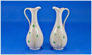 Irish Belleek Vases In The Form Of A Jug With Handle, with embossed shamrock decoration in green.