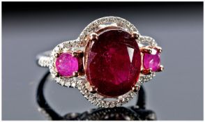 14ct White Gold Diamond & Ruby Ring, Set With A Large Central Ruby Between Two Smaller Rubies (