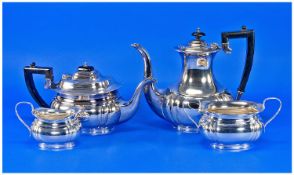 A Four Piece Silver Plated Queen Anne Shaped Tea Set. Made by Harts, Sheffield, with ebony handles.