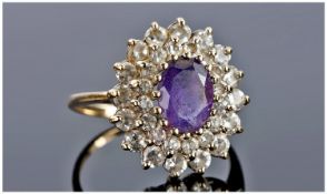 9ct Gold Amethyst Cluster Ring Set With A Central Amethyst Surrounded By Round Cut CZ`s, Fully
