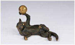 A Vintage Small Bronze Figure of a Playful Cat, with a golden ball. Unsigned. 2.5 inches high and