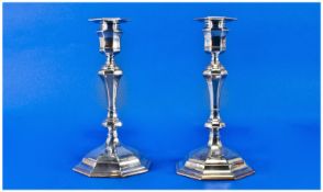 Edwardian Pair of Silver Candlesticks in the classical style on octagonal bases. Hallmarked London