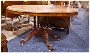 Victorian Walnut Inlaid Loo Table, with an oval shaped top inlaid to the to the margins and centre