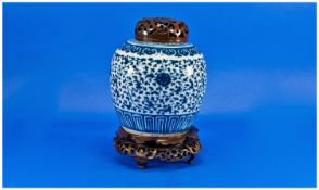 Chinese Blue & White Ginger Jar decorated in the winter rose pattern, on associated wood lid &