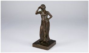 East European Signed Bronze Figure of a Young Dutch Girl. Raised on a square shaped plinth. Signed