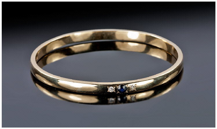 Ladies 9ct Gold Diamond And Sapphire Inset Bangle. Marked 9ct. Diameter 2.6 inches, 26.5 grams.