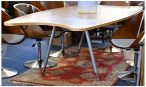 Contemporary Large Beech Veneered Table, Of Shaped Form Raised On A metal frame. Height 29 Inches.