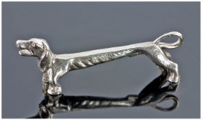 A Solid Silver Knife Stand In The Form Of A Dachshund Figure. Hallmark Sheffield 1977. Makers mark