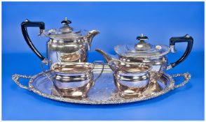 Oval Embossed EPNS Tray With A Four Piece Coffee & Tea Set By Elkington & Co. with ebony handles.