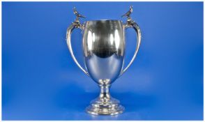 A Large Silver Pigeon Two Handled Trophy Vase, with figures of pigeons. Perched to the top of each