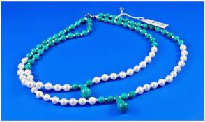 Turquoise and White Shell Pearl Double Strand Necklace, each strand being turquoise to the upper