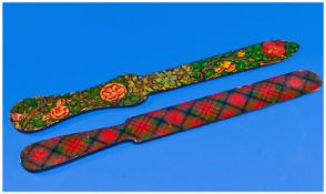 Two Lacquered Paper Knives. One Persian, Indian design. The other Scottish Tartan design. Name to