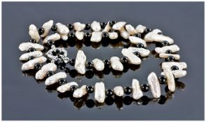 White Freshwater Biwa Pearl and Black Agate Necklace, the very high lustre, rare, biwa pearls