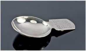 Mappin and Webb. A fine silver caddy spoon. The handle etched with the Prince of Wales feathers in