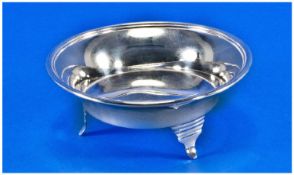 A Small Silver Bowl Shaped Raised On 3 Stylised Feet with reeded border of plain form. Hallmark