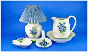 Four Piece Dressing Table Set, blue and green floral decoration on white ground. Comprises table