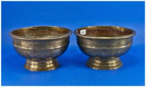 Pair Of Finely Chased Indian Footed Bowls, both with Buddhist symbols to the body with floral